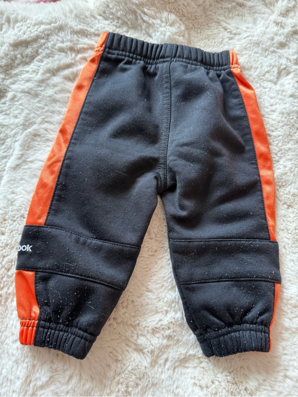 Reebok Kids Black Joggers with Orange Side Panels